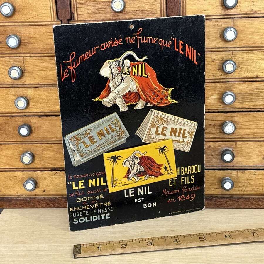 Le Nil Cigarette Papers Elephant image Advertising Card Sign c1920s