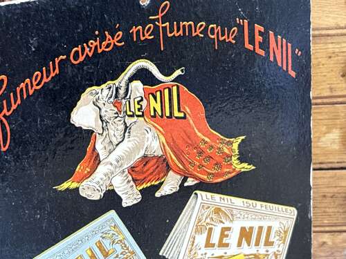 Le Nil Cigarette Papers Elephant image Advertising Card Sign c1920s